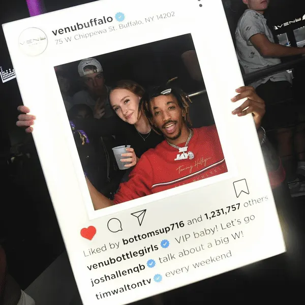 Click to enlarge Nightclub patron holding a custom Instagram Presenter.