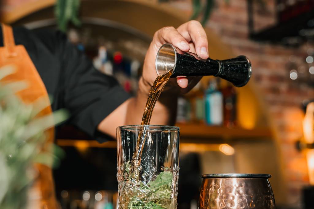 A steakhouse tableside presentation moment guests are filming on their phones